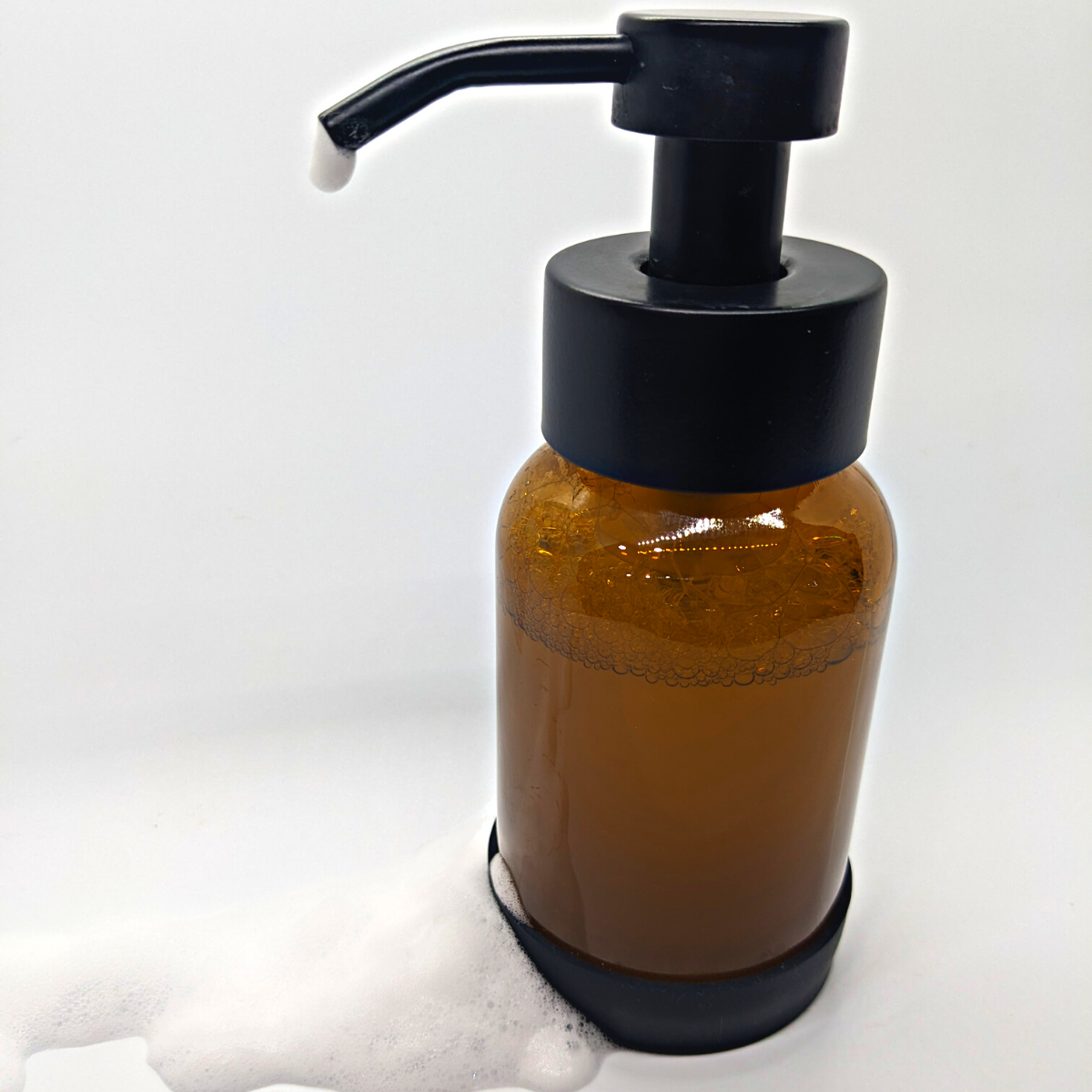 Refillable Foaming Soap Dispenser. Amber Glass with Silicone Base